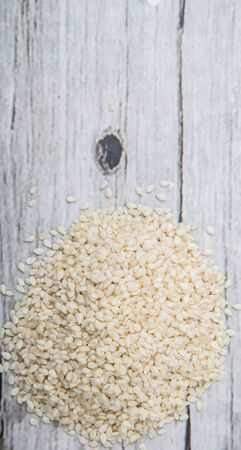 White sesame seed over wooden backgroundの写真素材