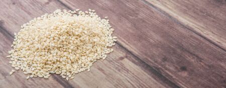 White sesame seed over wooden backgroundの写真素材