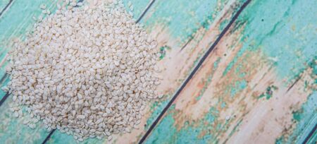 White sesame seed over wooden backgroundの写真素材
