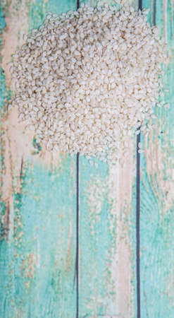 White sesame seed over wooden backgroundの写真素材