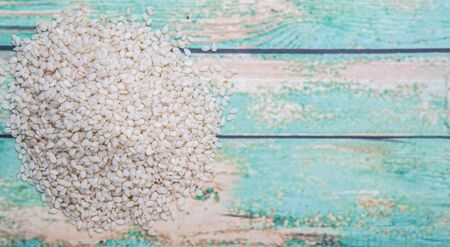 White sesame seed over wooden backgroundの写真素材