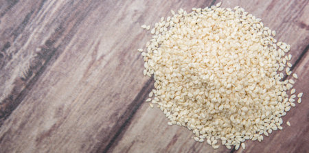White sesame seed over wooden backgroundの写真素材