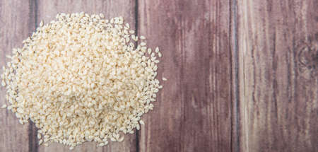 White sesame seed over wooden backgroundの写真素材