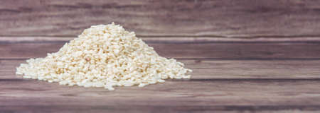 White sesame seed over wooden backgroundの写真素材