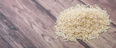 White sesame seed over wooden backgroundの写真素材