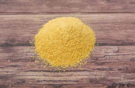 Dried bakers yeast over wooden backgroundの写真素材