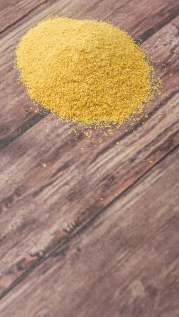 Dried bakers yeast over wooden backgroundの写真素材