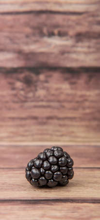 Blackberry fruit over wooden backgroundの写真素材