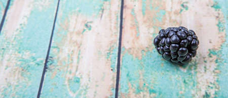 Blackberry fruit over wooden backgroundの写真素材