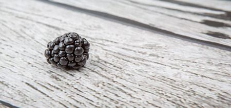 Blackberry fruit over wooden backgroundの写真素材
