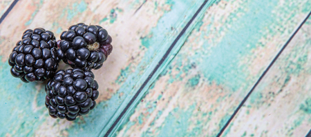 Blackberry fruit over wooden backgroundの写真素材
