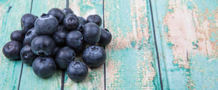 Blueberry fruit over wooden backgroundの写真素材