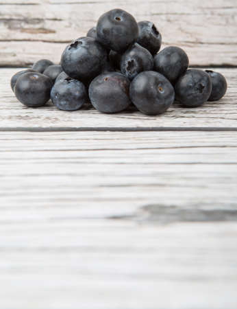 Blueberry fruit over wooden backgroundの写真素材