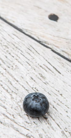 Blueberry fruit over wooden backgroundの写真素材
