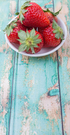 Strawberry fruit over wooden backgroundの写真素材
