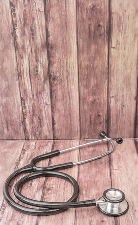 Medical stethoscope over wooden backgroundの写真素材