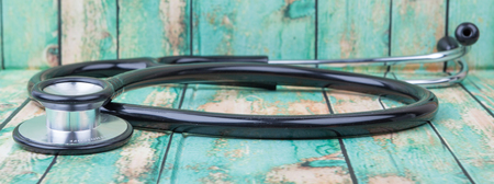 Medical stethoscope over wooden backgroundの写真素材
