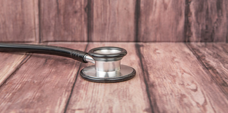 Medical stethoscope over wooden backgroundの写真素材