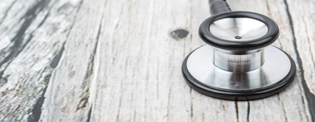 Medical stethoscope over wooden backgroundの写真素材
