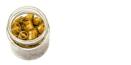 Pickled chili in white bowl over white backgroundの写真素材