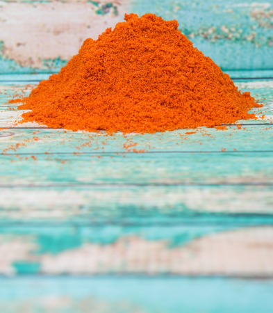 Cayenne pepper powder over wooden backgroundの写真素材