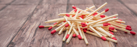 Matchsticks over wooden backgroundの写真素材