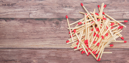 Matchsticks over wooden backgroundの写真素材