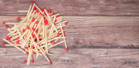 Matchsticks over wooden backgroundの写真素材
