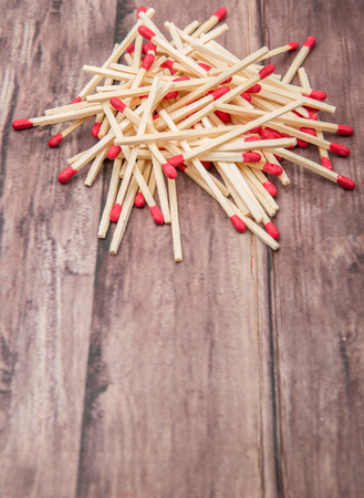 Matchsticks over wooden background