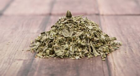 Dried marjoram herbs over wooden backgroundの写真素材