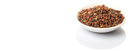 Sichuan pepper or peppercorn, also known as Chinese coriander over white backgroundの写真素材