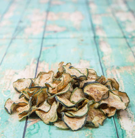 Dried zucchini or courgette over wooden backgroundの写真素材