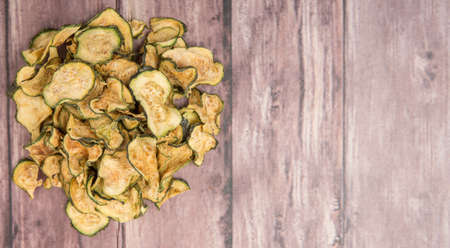 Dried zucchini or courgette over wooden backgroundの写真素材