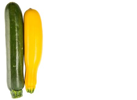 Yellow and green zucchini vegetable over white backgroundの写真素材