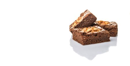 Chocolate walnut brownies over white backgroundの写真素材