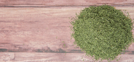 Dried dill herbs over rustic wooden backgroundの写真素材
