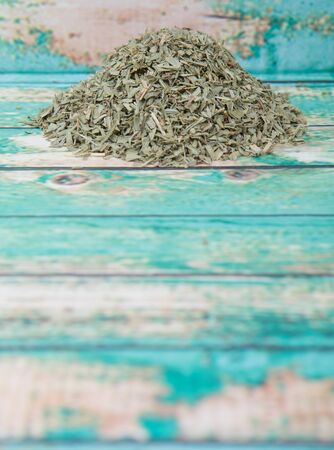 Dried tarragon herb over wooden backgroundの写真素材