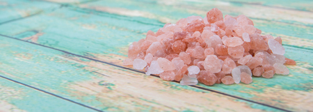 Himalaya or Himalayan rock salt over wooden backgroundの写真素材