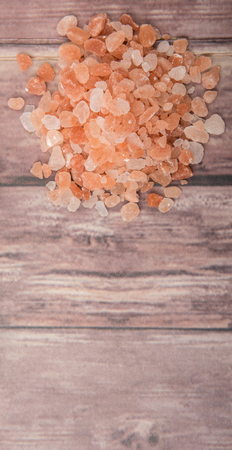 Himalaya or Himalayan rock salt over wooden backgroundの写真素材