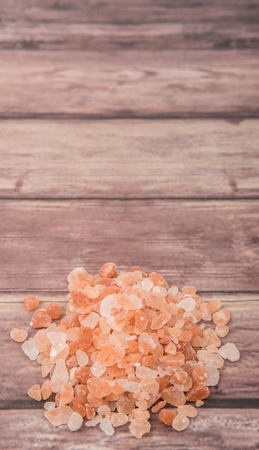 Himalaya or Himalayan rock salt over wooden backgroundの写真素材