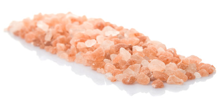 Himalaya or Himalayan rock salt over white backgroundの写真素材