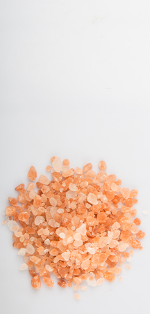 Himalaya or Himalayan rock salt over white backgroundの写真素材