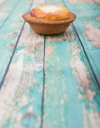 Homemade Japanese cheese tart over wooden backgroundの写真素材