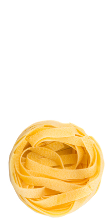 Dried tagliatelle pasta or ribbon shaped pasta or nest shape pasta over white backgroundの写真素材