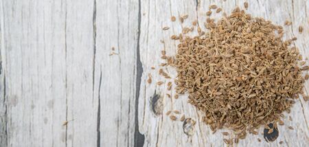 Dried anise seed or aniseed over wooden backgroundの写真素材
