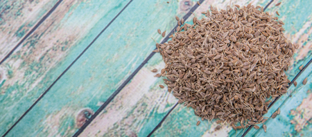 Dried anise seed or aniseed over wooden backgroundの写真素材