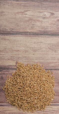 Dried anise seed or aniseed over wooden backgroundの写真素材