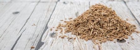 Dried anise seed or aniseed over wooden backgroundの写真素材