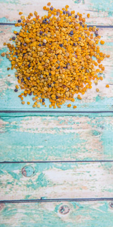 Bee pollen over wooden backgroundの写真素材
