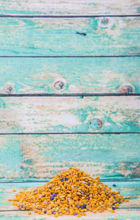 Bee pollen over wooden background